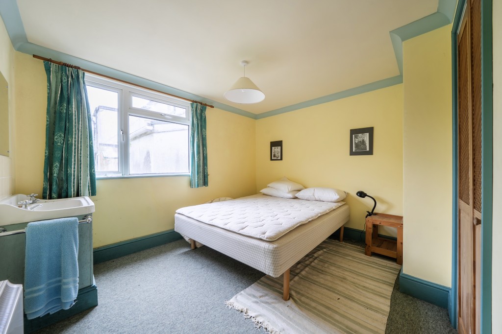 Lot: 47812 - FORMER CAPTAINS HOUSE PLUS THREE-BEDROOM BUNGALOW SET IN OVER 8.5 ACRES OF LAND WITH COUNTRYSIDE AND SEA VIEWS - Seascape double bedroom